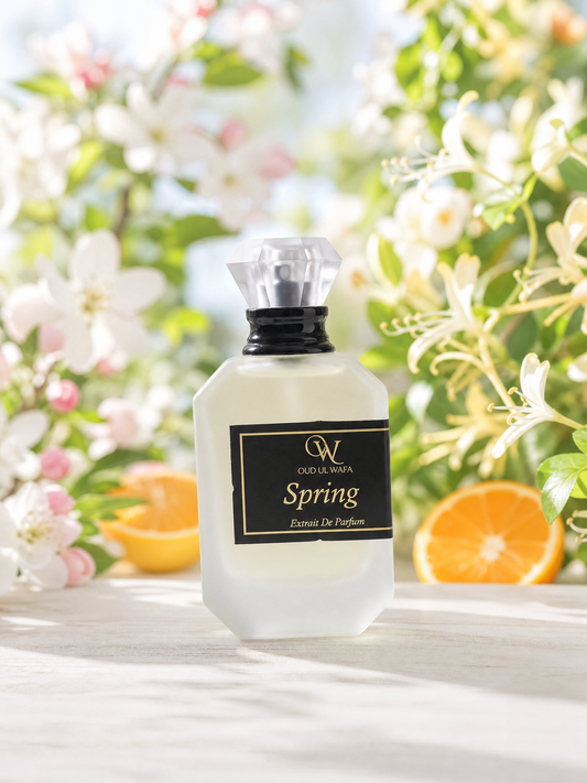 Perfume bottle labeled 'Spring' with floral and fruit background, spring by oud ul wafa is long lasting fragrance for women and free shipping across pakistan