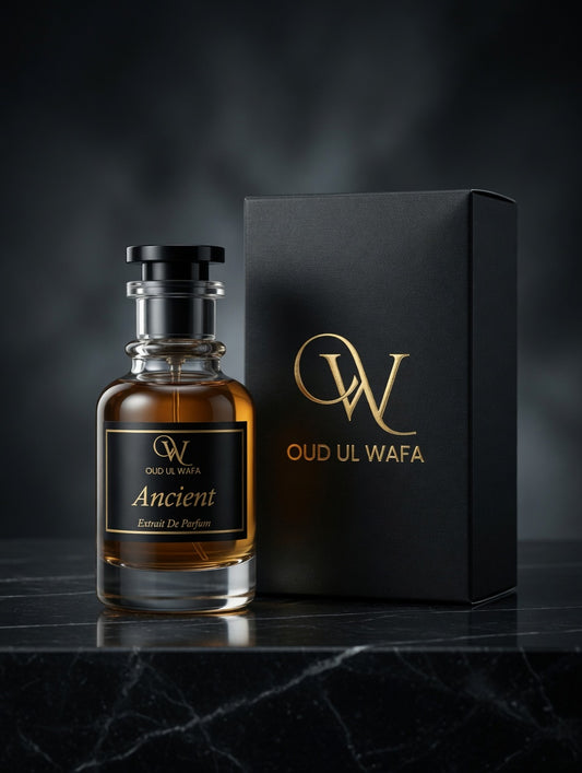 Oud Ul Wafa perfume bottle and packaging on a dark surface with a dark background