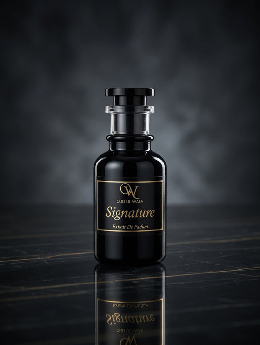 Black perfume bottle with gold label on a reflective surface and dark background