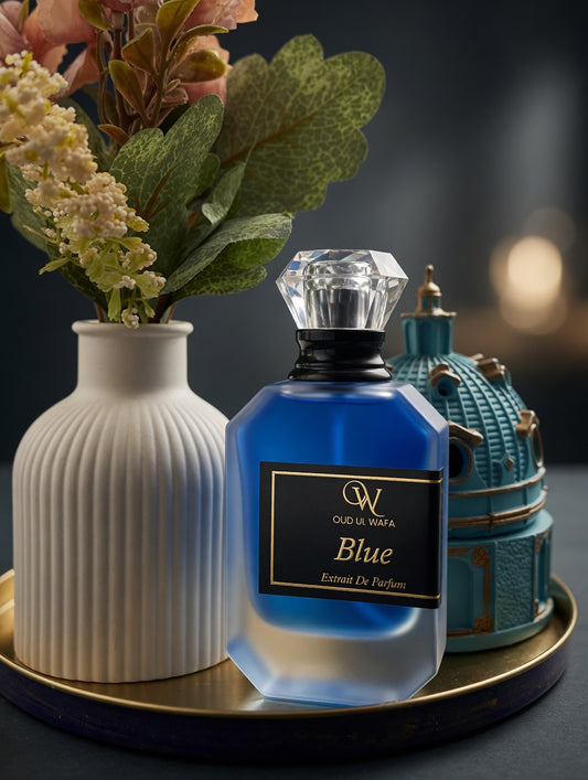 Blue perfume bottle with decorative elements on a dark background